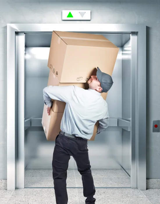 A person who enters a Cargo elevator with three cartons - Cargo Lift Supplier In UAE